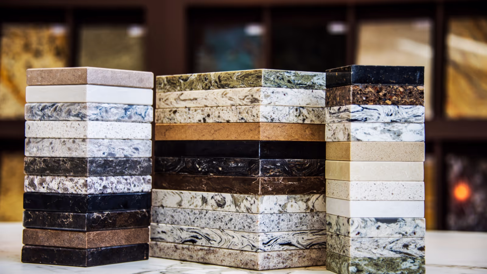 Various stone color samples for kitchen countertops, granite, marble and quartz in different colors. Brown, gray, dark , white and black.