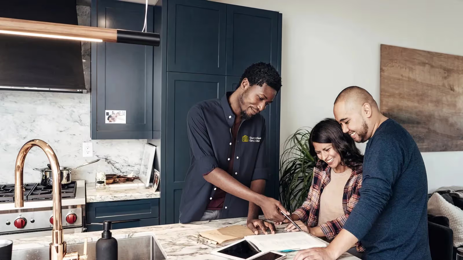 Surprise Granite contractor going over kitchen remodeling permits with Arizona homeowners.